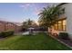 Lush backyard with an outdoor grill, landscaped garden, providing a serene outdoor space at 20689 W Valley View Dr, Buckeye, AZ 85396