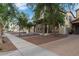 Charming two-story home with stone accents, a well-manicured front yard, and a welcoming entrance at 20689 W Valley View Dr, Buckeye, AZ 85396