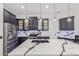 Modern kitchen with a large island, stainless steel appliances, and plenty of cabinet space at 20689 W Valley View Dr, Buckeye, AZ 85396
