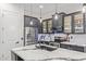 Kitchen features stainless appliances, quartz countertops, and eat-in island at 20689 W Valley View Dr, Buckeye, AZ 85396