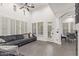 Bright living room with high ceilings, large windows, comfortable seating, and access to the outdoors at 20689 W Valley View Dr, Buckeye, AZ 85396