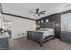 Main bedroom with ceiling fan and ensuite bathroom at 20689 W Valley View Dr, Buckeye, AZ 85396