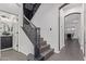 Elegant staircase with dark railings and decorative spindles, leading to the upper level at 20689 W Valley View Dr, Buckeye, AZ 85396