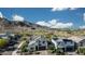 Aerial view of a house with mountain views, desert landscaping, and a blue sky at 21194 W Hillcrest Blvd, Buckeye, AZ 85396