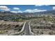 Aerial view of a well-planned community with mountain views and desert landscaping at 21194 W Hillcrest Blvd, Buckeye, AZ 85396