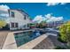Exterior view of home showcasing the backyard pool, spa, and outdoor living space at 21194 W Hillcrest Blvd, Buckeye, AZ 85396