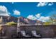 Backyard seating area with mountain views and comfortable outdoor furniture at 21194 W Hillcrest Blvd, Buckeye, AZ 85396