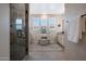 Modern bathroom featuring glass enclosed shower, double vanities, and decorative area rug at 21194 W Hillcrest Blvd, Buckeye, AZ 85396