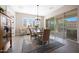 Elegant dining room with patio access, plantation shutters, and stylish chandelier at 21194 W Hillcrest Blvd, Buckeye, AZ 85396