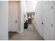 Inviting foyer with wood-look tile flooring, neutral walls, and lots of natural light at 21194 W Hillcrest Blvd, Buckeye, AZ 85396