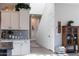 Hallway and staircase next to kitchen, offering a smooth transition and showcasing home's layout at 21194 W Hillcrest Blvd, Buckeye, AZ 85396