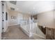 Second floor hallway featuring carpeting, and a view of the staircase at 21194 W Hillcrest Blvd, Buckeye, AZ 85396
