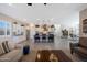 Open-concept kitchen with a large island, stainless steel appliances, and views into the living area at 21194 W Hillcrest Blvd, Buckeye, AZ 85396