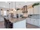 Gourmet kitchen with granite countertops, stainless steel appliances, and a stylish range hood at 21194 W Hillcrest Blvd, Buckeye, AZ 85396