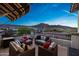 Stylish patio with comfortable wicker seating, and picturesque mountain views at 21194 W Hillcrest Blvd, Buckeye, AZ 85396