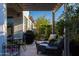 Covered patio featuring comfortable seating and a view of the landscaped backyard at 21194 W Hillcrest Blvd, Buckeye, AZ 85396