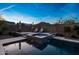 Relaxing backyard featuring a pool with spa and poolside seating, ideal for outdoor enjoyment at 21194 W Hillcrest Blvd, Buckeye, AZ 85396