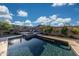 Beautiful backyard with a sparkling pool, spa, and patio area with stunning mountain views at 21194 W Hillcrest Blvd, Buckeye, AZ 85396