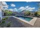 Stunning backyard with a modern pool, spa, and lounge area with mountain views at 21194 W Hillcrest Blvd, Buckeye, AZ 85396