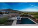 A serene pool with mountain vistas offers a tranquil outdoor oasis at 21194 W Hillcrest Blvd, Buckeye, AZ 85396