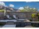 Relaxing poolside seating area with a spa overlooking the pool, perfect for unwinding and enjoying the outdoors at 21194 W Hillcrest Blvd, Buckeye, AZ 85396