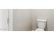 Compact bathroom features a standard toilet and fresh neutral paint, ideal for guest use or as a secondary bath at 21228 N 58Th St, Phoenix, AZ 85054