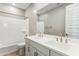 Bathroom with double sink vanity, shower over tub, and neutral cabinets at 21228 N 58Th St, Phoenix, AZ 85054