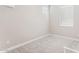 Bright bedroom featuring neutral walls, plush carpeting, and natural light from multiple windows with blinds at 21228 N 58Th St, Phoenix, AZ 85054
