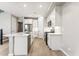 Modern kitchen featuring stainless steel appliances, bright white cabinetry, and a functional island with seating at 21228 N 58Th St, Phoenix, AZ 85054