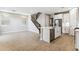 Spacious living room with a modern kitchen island, stainless steel appliances, and elegant tile floors at 21228 N 58Th St, Phoenix, AZ 85054