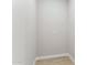 A room with a single outlet and wood-look flooring, clean and ready for customization at 21228 N 58Th St, Phoenix, AZ 85054