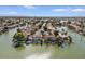 Stunning aerial view of a waterfront community with lush landscaping and private docks at 2135 E Clipper Ln, Gilbert, AZ 85234
