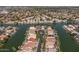 Aerial view of a neighborhood with waterfront properties and lush landscaping at 2135 E Clipper Ln, Gilbert, AZ 85234