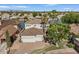 Stunning aerial view of the home, landscaped grounds, and the surrounding neighborhood near the lake at 2135 E Clipper Ln, Gilbert, AZ 85234