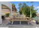 Backyard patio with picnic table, bar, and view of the lakefront, perfect for outdoor gatherings at 2135 E Clipper Ln, Gilbert, AZ 85234