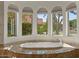 Serene bathroom with large garden tub and bay windows at 2135 E Clipper Ln, Gilbert, AZ 85234