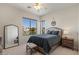 Light-filled bedroom with lake views, featuring neutral tones and comfortable furnishings at 2135 E Clipper Ln, Gilbert, AZ 85234
