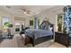 Large bedroom with deck access and a private sitting area at 2135 E Clipper Ln, Gilbert, AZ 85234