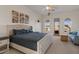 Spacious bedroom with a large window view and cozy seating area, filled with natural light at 2135 E Clipper Ln, Gilbert, AZ 85234