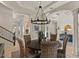 Elegant dining room with stylish chandelier and seating for six at 2135 E Clipper Ln, Gilbert, AZ 85234