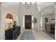 Foyer with high ceilings, grand chandelier, and custom design details at 2135 E Clipper Ln, Gilbert, AZ 85234