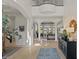 Open foyer with grand columns, high ceilings, and an open view of the lake at 2135 E Clipper Ln, Gilbert, AZ 85234