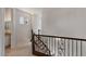 Bright hallway features decorative wrought iron railing and arched stained glass windows at 2135 E Clipper Ln, Gilbert, AZ 85234