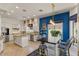Spacious kitchen with eat-in area, granite counters, stainless appliances, and custom lighting at 2135 E Clipper Ln, Gilbert, AZ 85234
