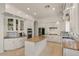Well-lit kitchen featuring granite countertops, a kitchen island, and stainless steel appliances at 2135 E Clipper Ln, Gilbert, AZ 85234