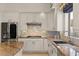 Bright kitchen with stainless steel refrigerator and beautiful granite countertops at 2135 E Clipper Ln, Gilbert, AZ 85234