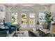 Bright living room with views of the lake, comfortable seating, and French doors at 2135 E Clipper Ln, Gilbert, AZ 85234