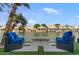 Cozy seating area with fire pit on a beautiful back patio by the lake at 2135 E Clipper Ln, Gilbert, AZ 85234