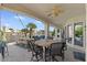 Lakeside patio with an outdoor seating area and manicured landscaping, ideal for enjoying the serene waterfront views at 2135 E Clipper Ln, Gilbert, AZ 85234
