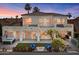 Beautiful rear exterior with a spa, lawn, outdoor seating, and lush landscaping at 2135 E Clipper Ln, Gilbert, AZ 85234